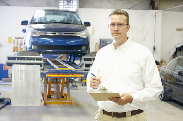 A Walter Jay Collision Center technician at work in the shop